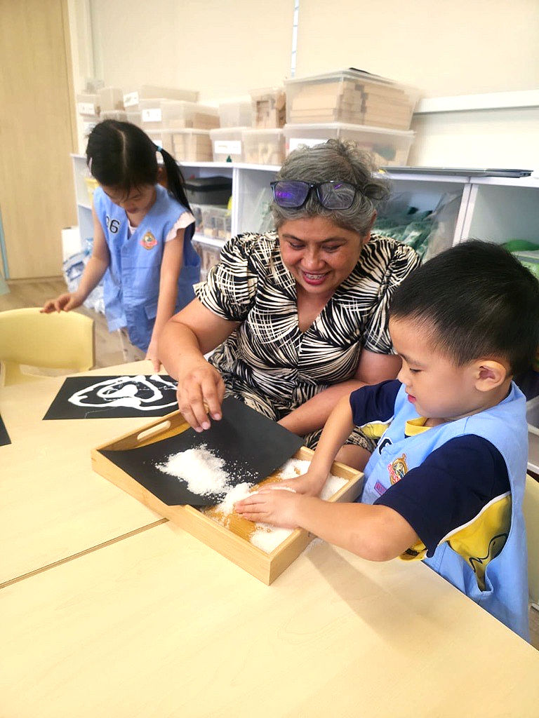 Current Principal, Ms Anita Kaur, teaching Explorer's Programme at The Chinese Kindergarten