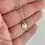 Thumbnail: Gold Petoskey Patterns Small Circle Necklace