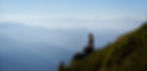 sporty-young-woman-meditating-mountains.jpg