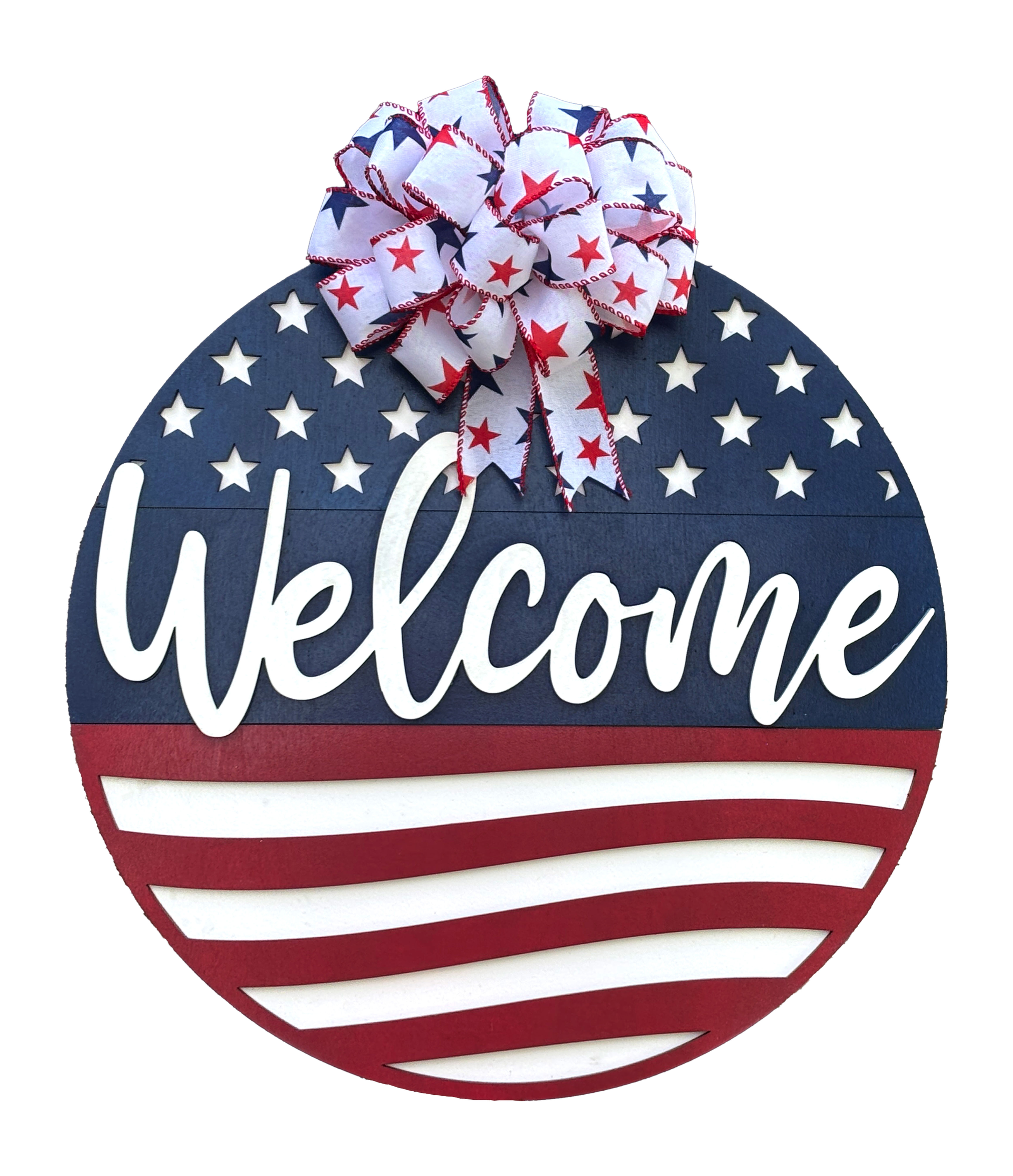Round sign designed as an American flag with Welcome in white script over a blue background, stars, and red and white stripes