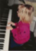 Mary playing piano age 4