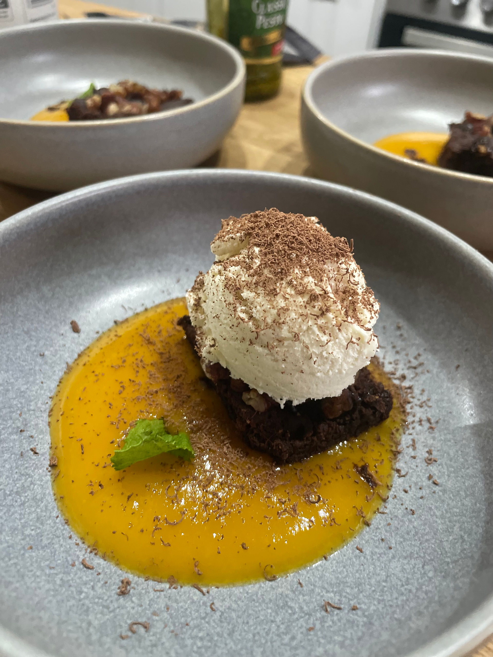 home made brownie with mango sauce, basil, clotted ice cream and grated chocolate dessert made for artists at Seaview Villa Lynmouth