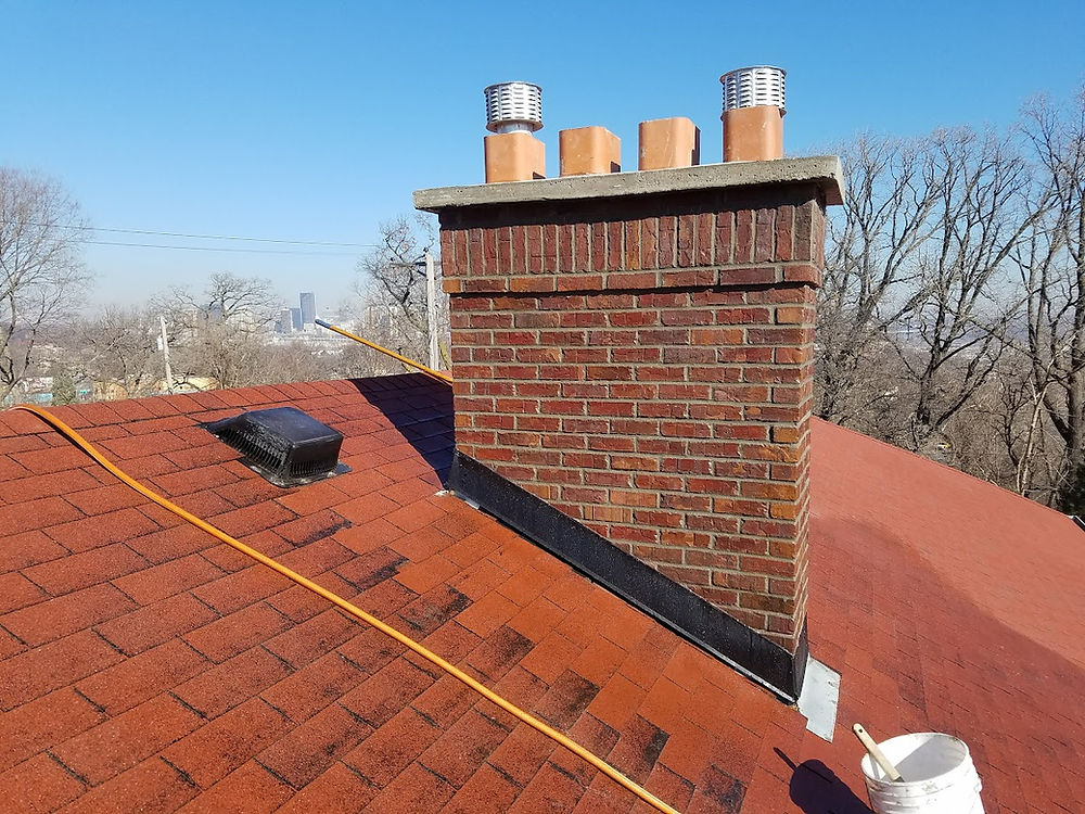 UBL masonry brick chimney on a red roof