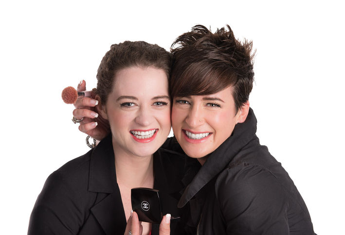 high key studio portrait of a commercial makeup artist  posing with a client
