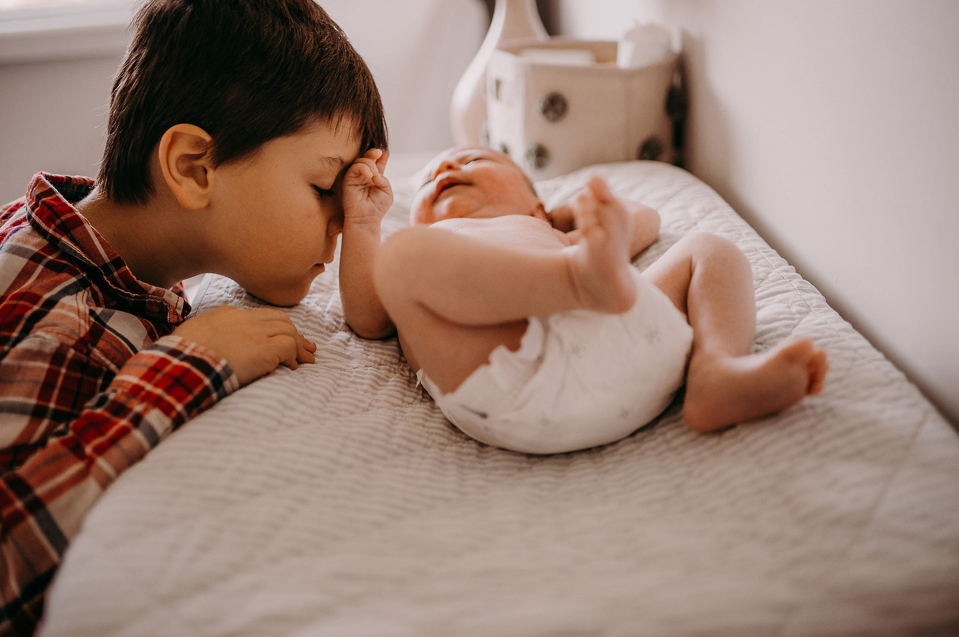 bother kissing baby hand