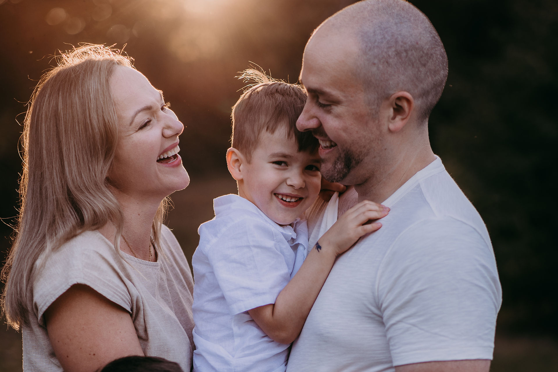 mother and father with sun