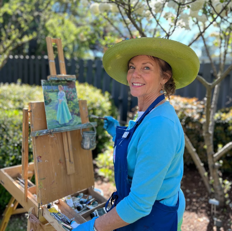 Cathy Poulos painting outside