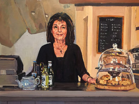 Maria at the counter of Bishop Percey's tearoom
