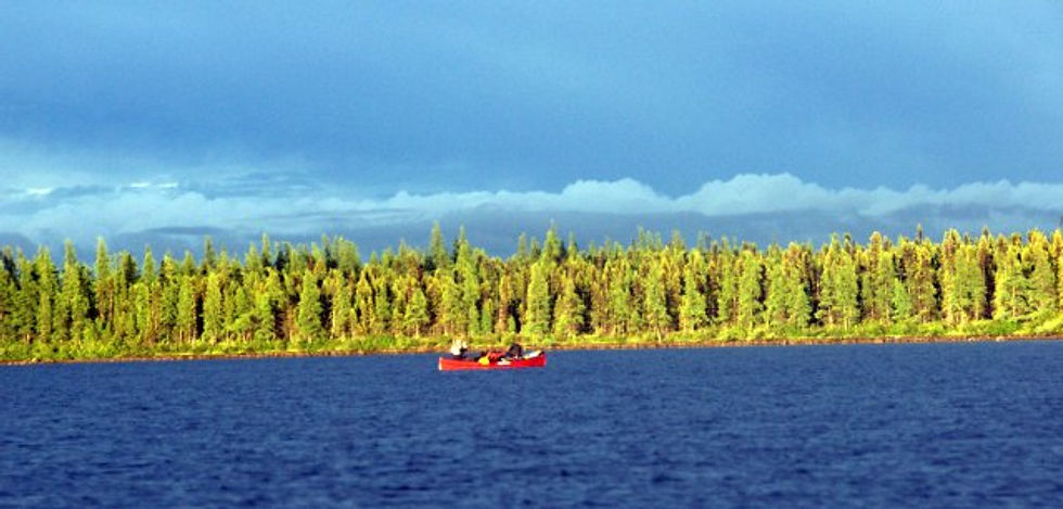Paddling in the headwaters of the Du Pas River.