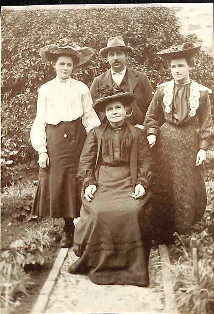Sepia family photograph with Anne E Smith with son, daughter and granddaughter