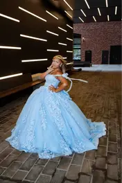 Sweet 16 celebrant in a light blue ball gown posing in a natural outdoor setting during an NJ Sweet 16 photography session.