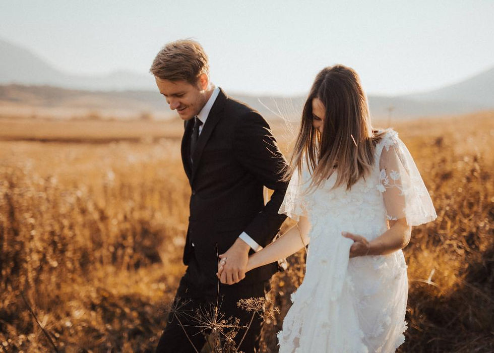Hand-in-hand stroll: Couple walks together during a New Jersey wedding photoshoot.