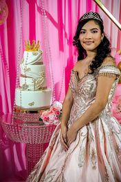 The Sweet 16 birthday girl dazzles in front of her cake, surrounded by joy and celebration in NYC.