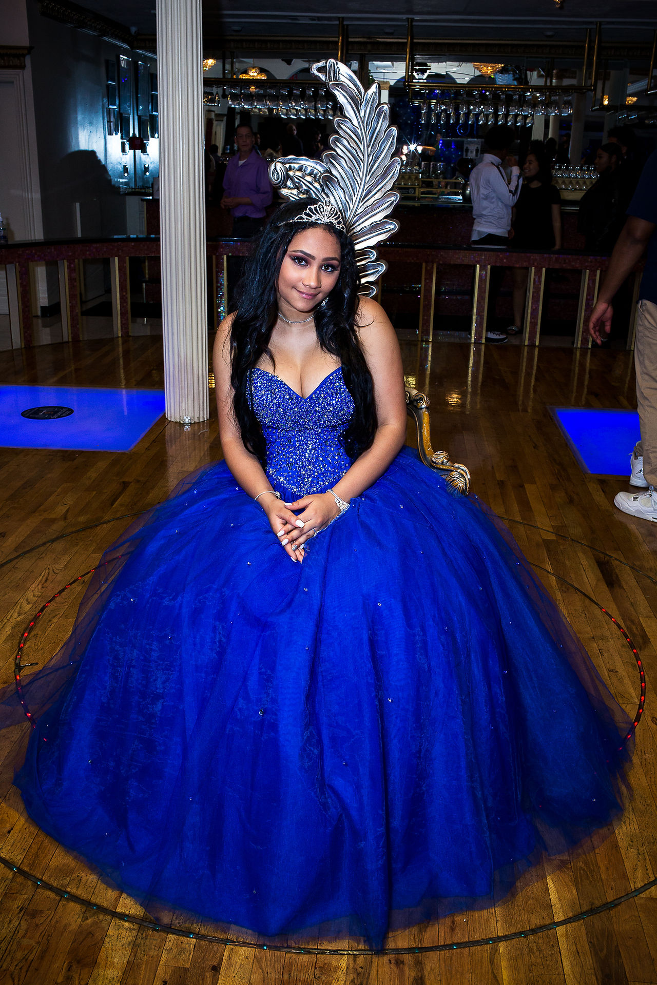Meet the Sweet 16 birthday star in her blue dress, shining bright with a sparkling tiara, ready to make memories in NYC.