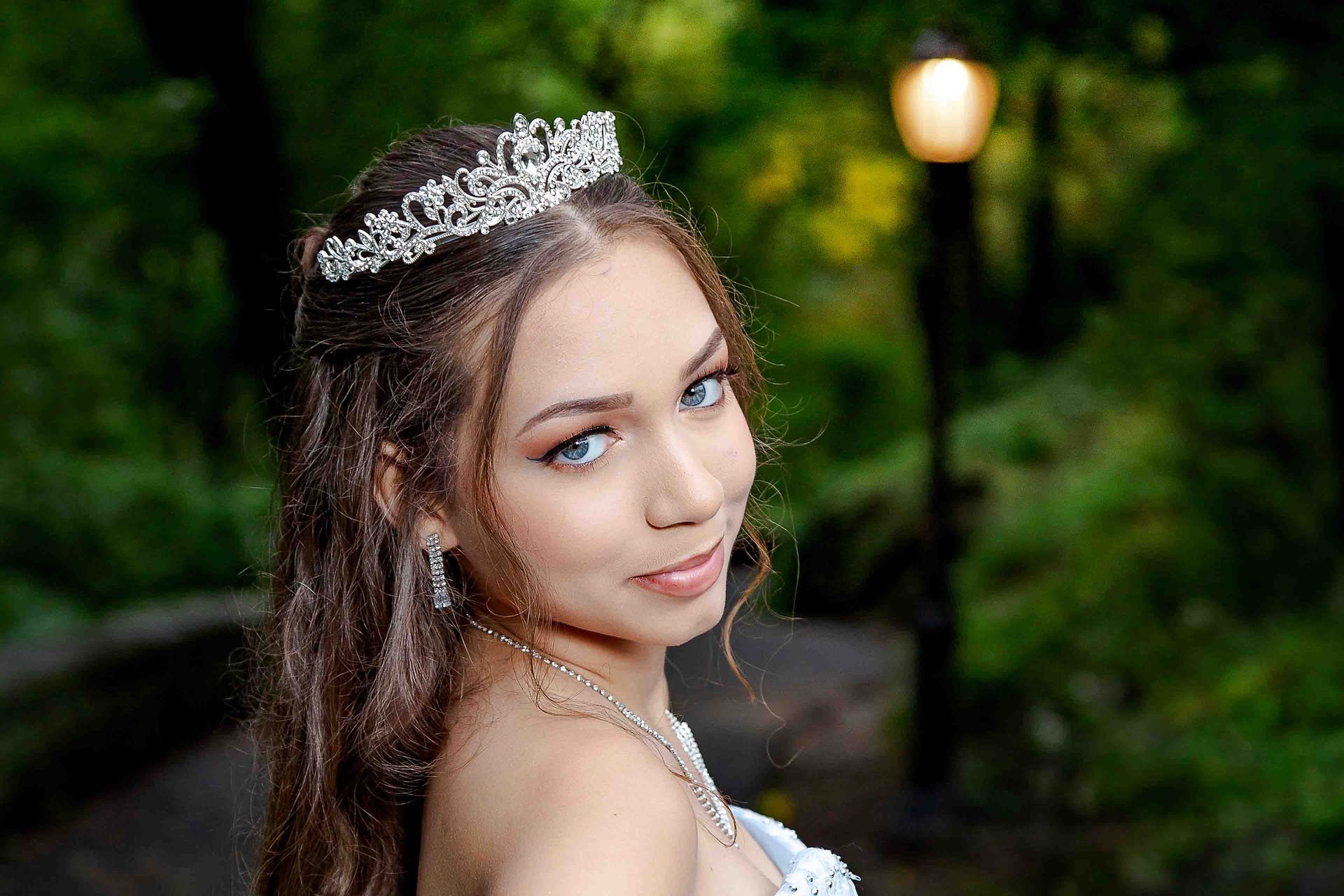 Outdoor Sweet 16 portrait of birthday girl with blue eyes wearing a tiara at her NJ celebration.