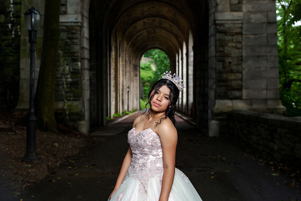 Quinceanera wearing a peach dress and a beautiful tiara