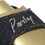 Thumbnail: Close-up view of the Vanilla (VNLA) Junior Chuck Parsley quad roller skate showing the denim strap with 'Parsley' signature stitching and gold accent detailing.