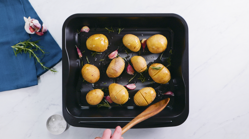 A roasting dish full of potatoes.