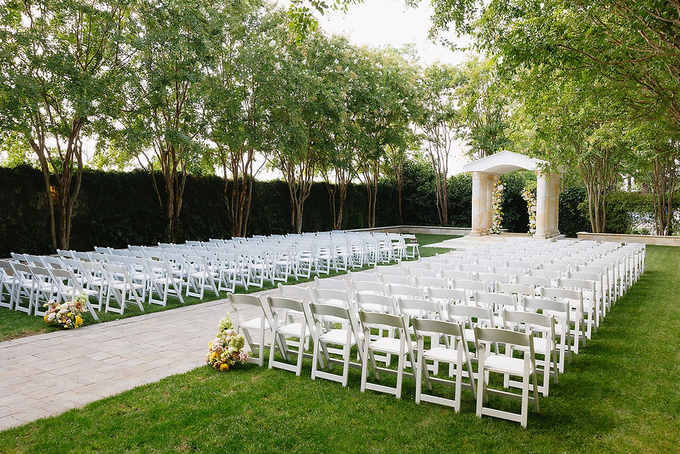 Couple Sharing Quiet Moment Beside Garden Fountain at Brownstone Gardens