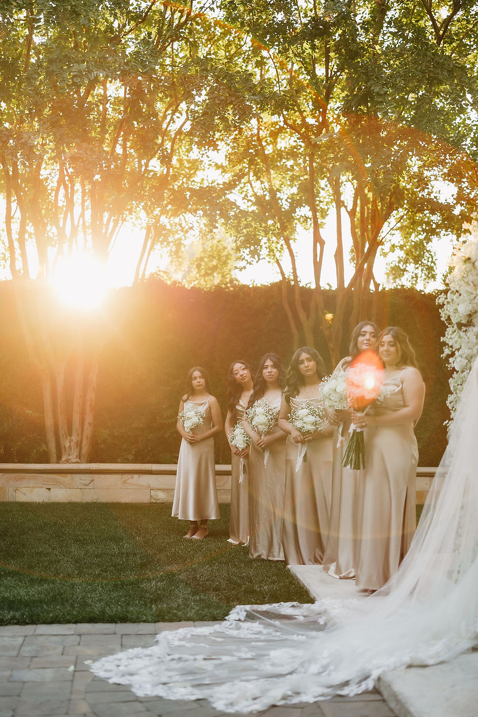 Bride and Groom Walking Through Natural Garden Path at Brownstone Gardens