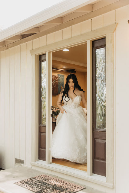 Bridal gown hanging in suite at Brownstone Gardens, Oakley.