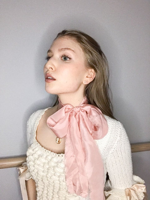 A girl in a pink bow