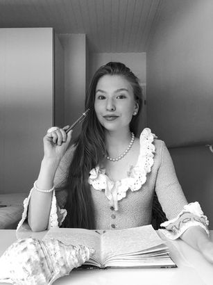 A girl at her writing desk