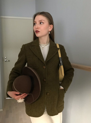 A girl wearing a classic tweed blazer