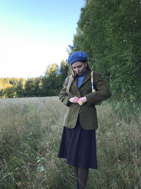 A girl in a tweed jacket