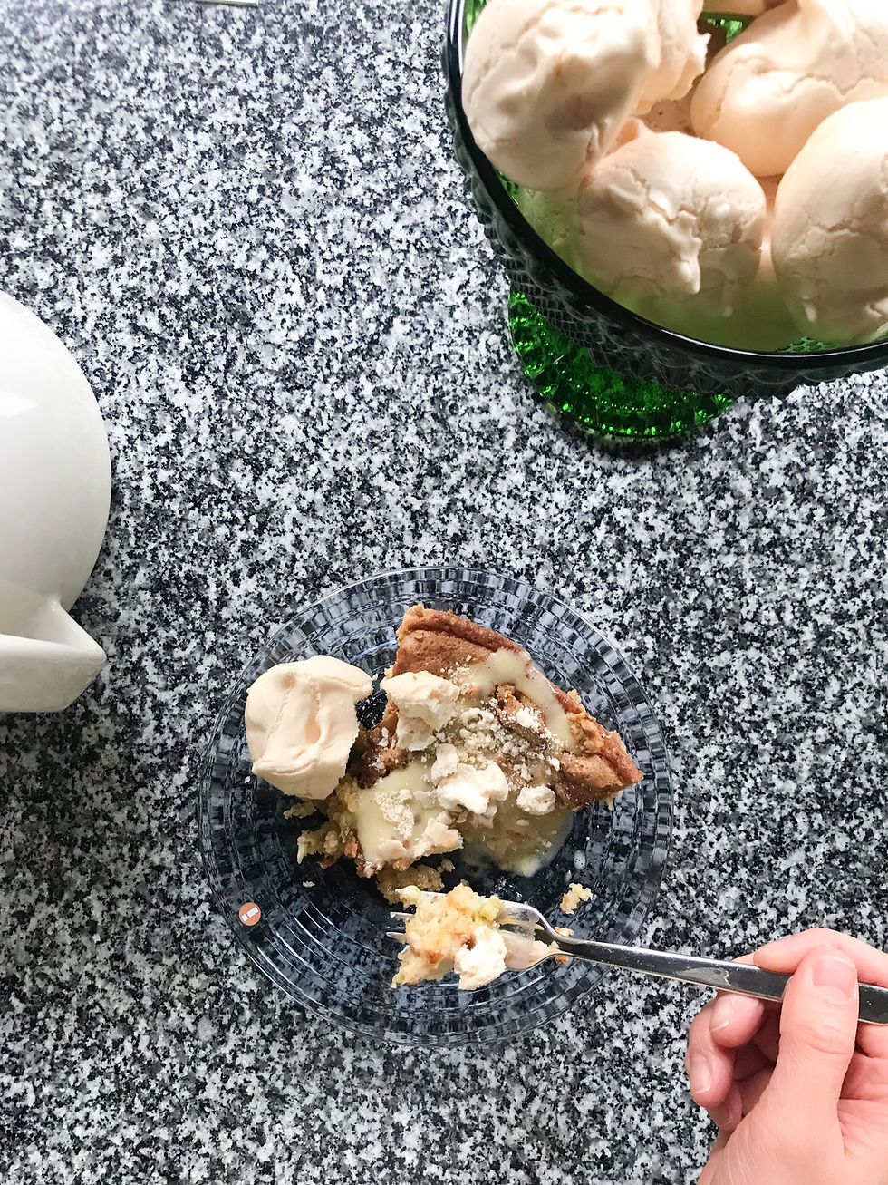 A plate of rhubarb pie with vanilla sauce and meringue