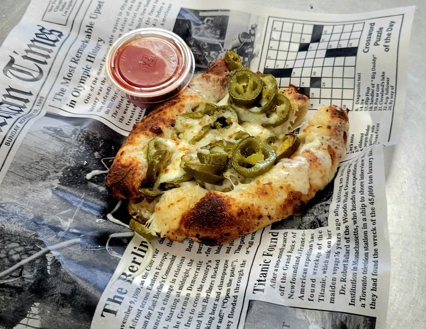 Jalapeno-topped cheesy baked appetizer with marinara sauce