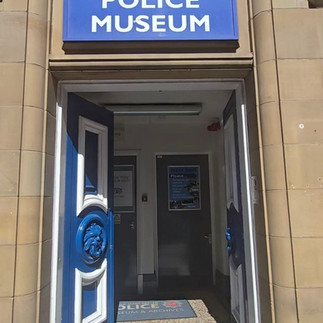 Entrance to Greater Manchester Police Museum with blue sign.