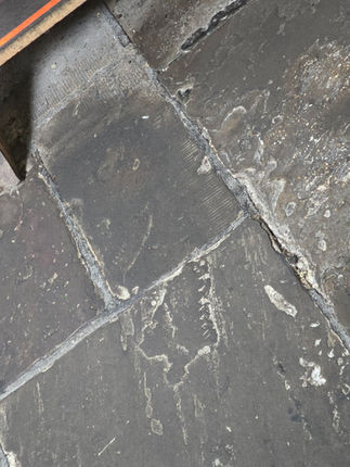 The stone flooring inside the church.