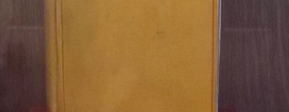 Yellow book cover of a signed first edition of Dracula by Bram Stoker at Whitby Abbey