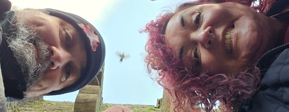 A selfie of the four of us taken from below. We appear on a side of the picture each.