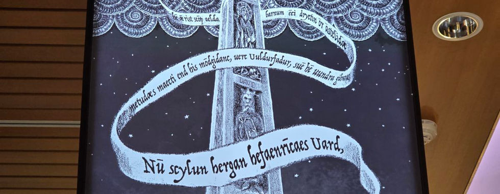 Illustrated museum display showing a man reclining beneath a tall monument at Whitby Abbey.