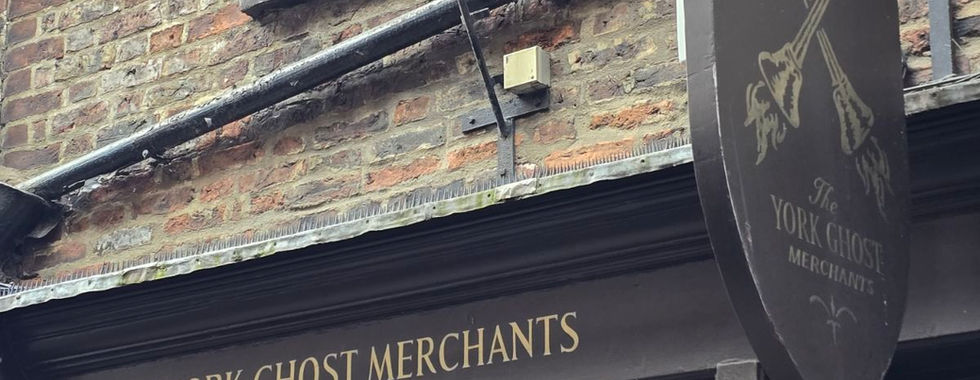 The York Ghost Merchants shop front and hanging sign.