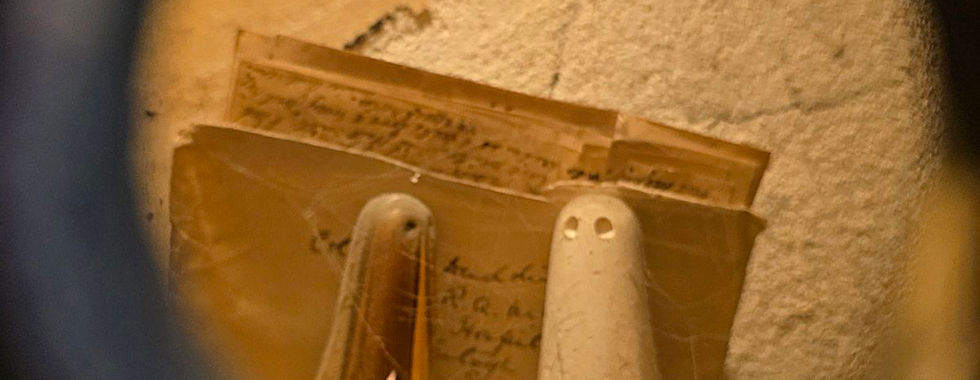 Small ghost figures in a York Ghost Merchants display.