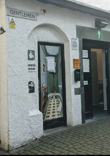 Entrance to the accessible and gentlemen's toilets.