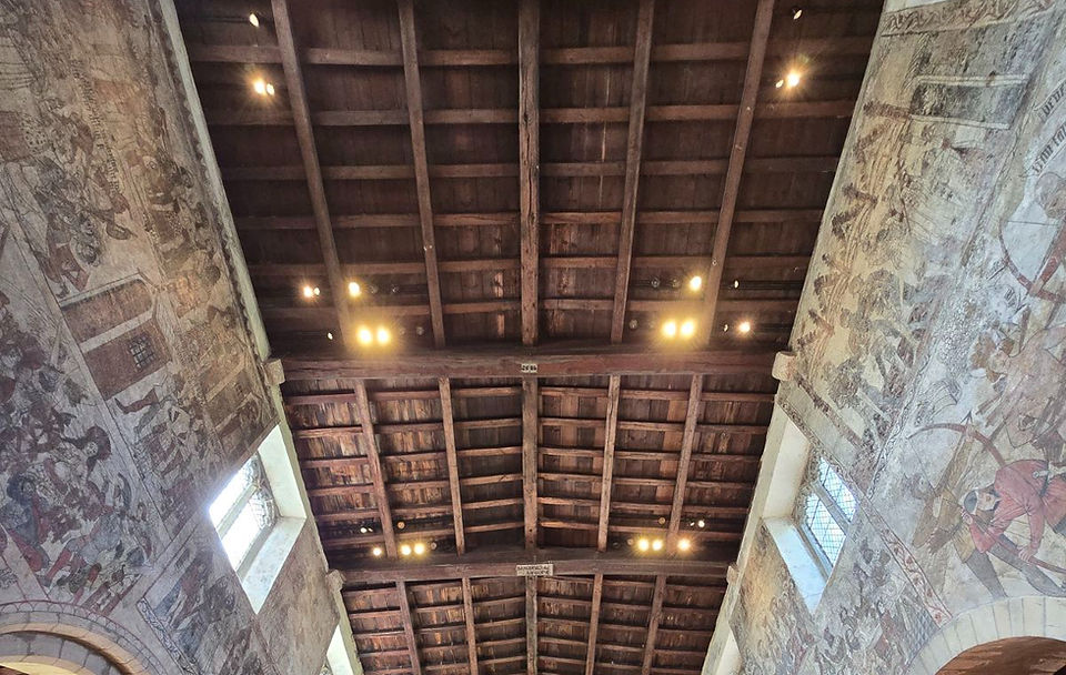 Medieval wall paintings and timber roof of the church.