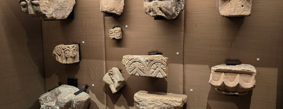 Ancient stone carvings in a Whitby Abbey museum display.