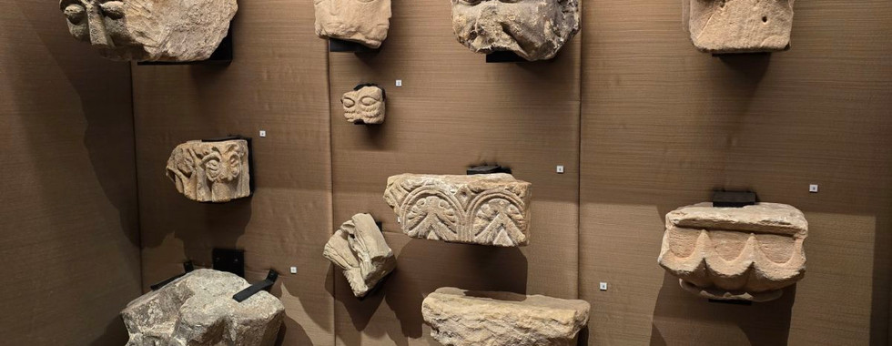 Ancient stone carvings in a Whitby Abbey museum display.