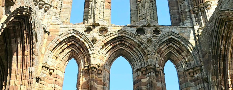 The four of us posing inside the Whitby Abbey ruins.