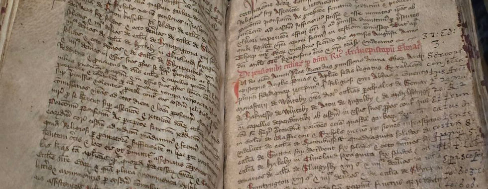 Ancient manuscript on display at Whitby Abbey museum.
