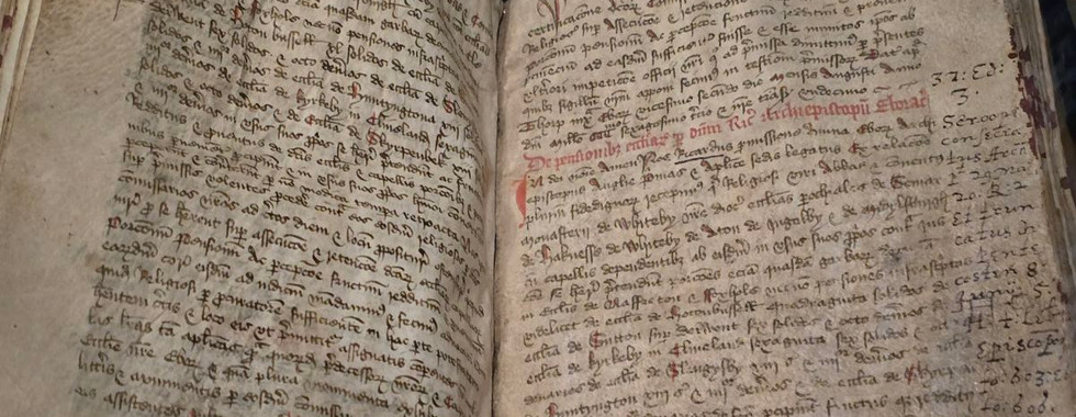 Ancient manuscript on display at Whitby Abbey museum.
