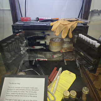 Forensic fingerprint kit with tools and evidence labels.