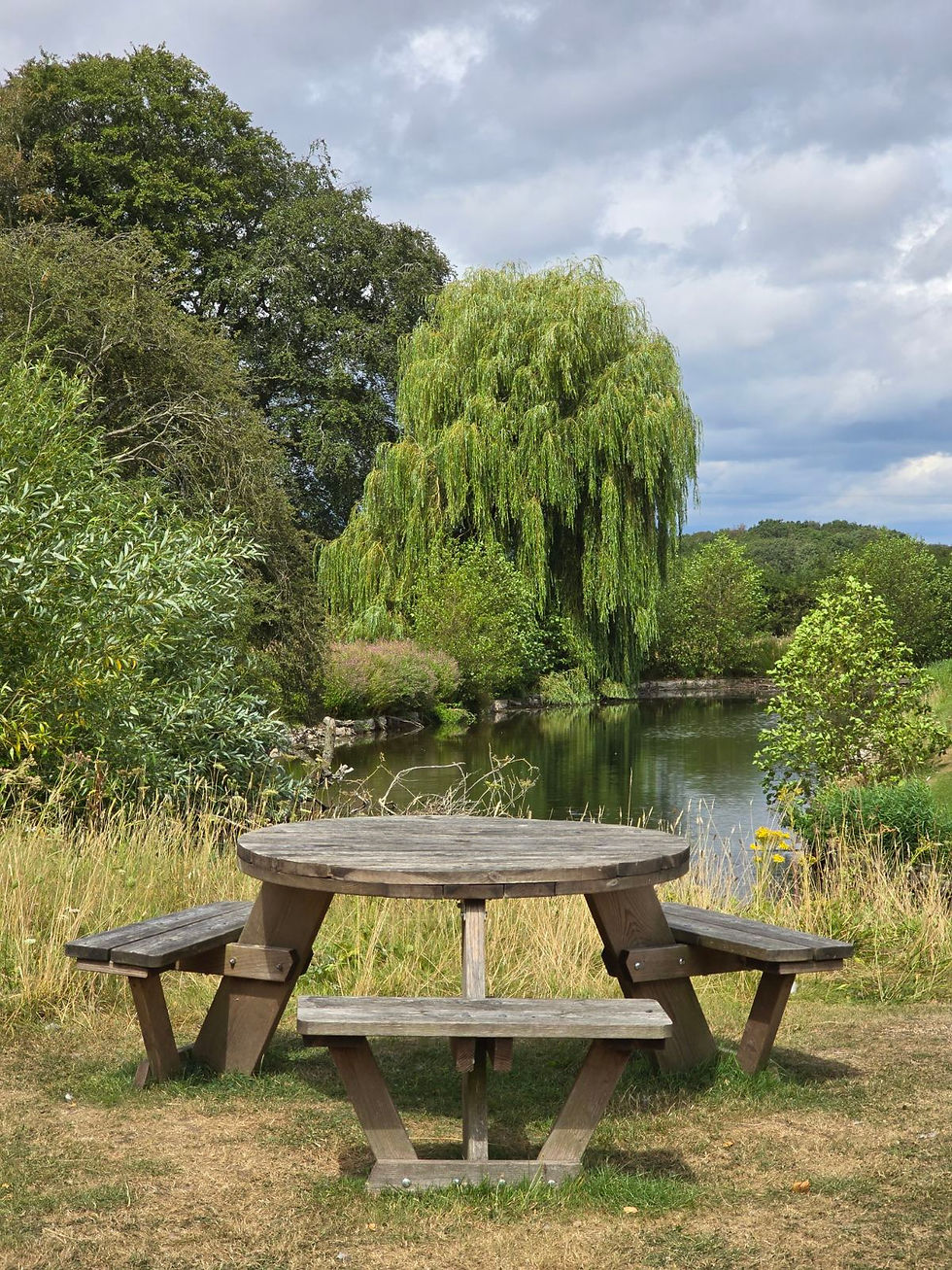 One of the picnic tables next to the moat.