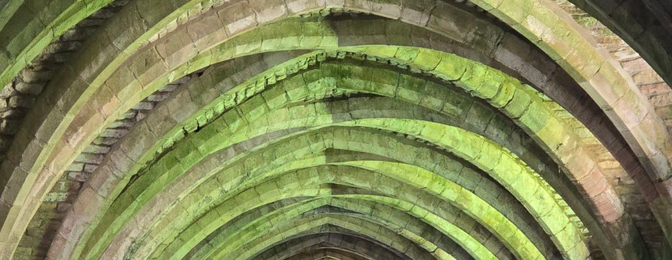 Vaulted stone ceiling of the cellarium at Fountains Abbey.
