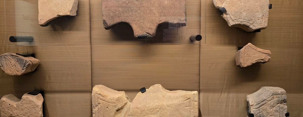 Stone carvings on display at Whitby Abbey museum.