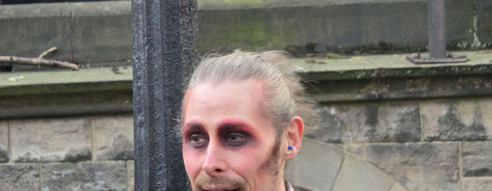 A tour guide in ghostly makeup for the Edinburgh Ghost Bus Tour.